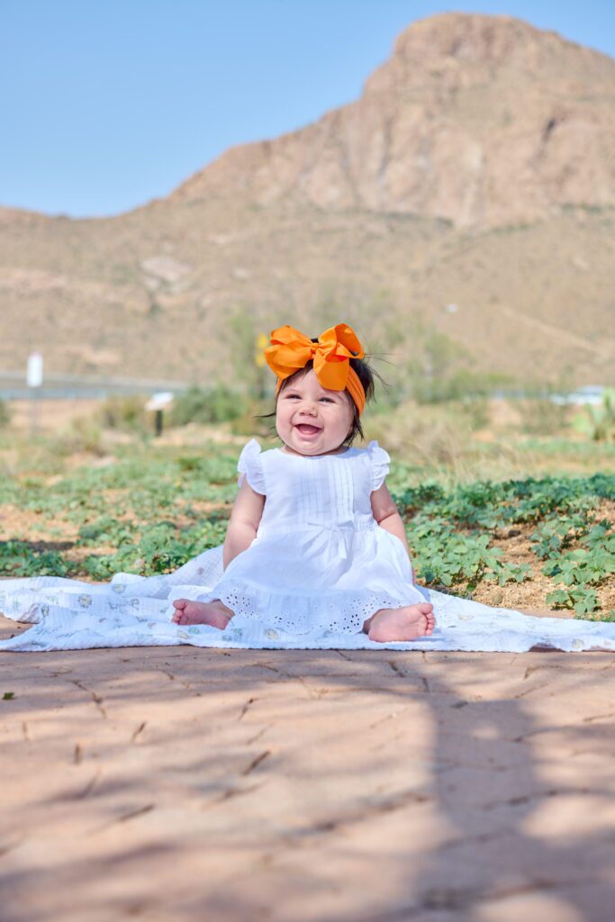 Lucille smiling happily outdoors.