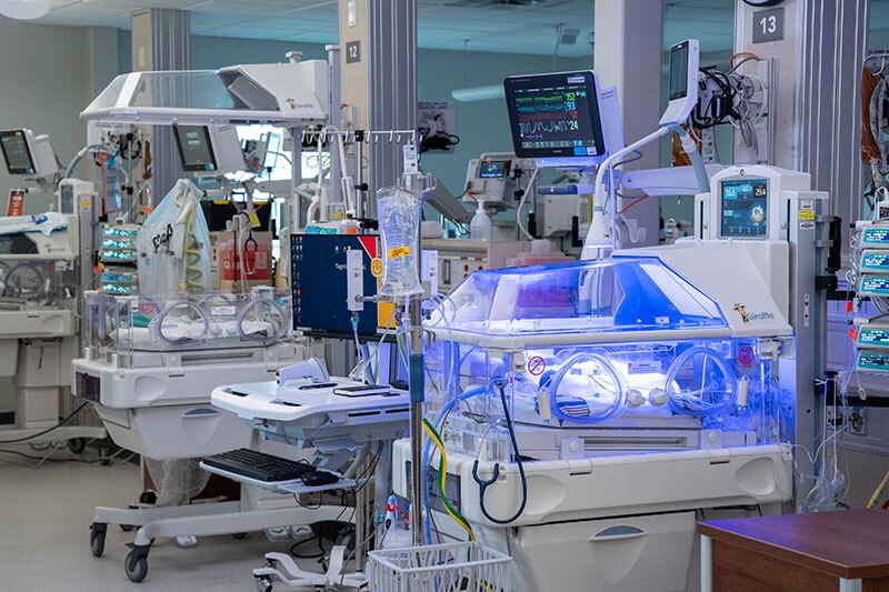 Neonatal intensive care unit with hospital equipment.