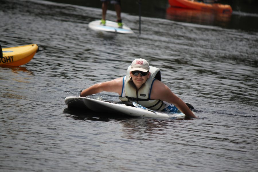 boy paddle bard at camp