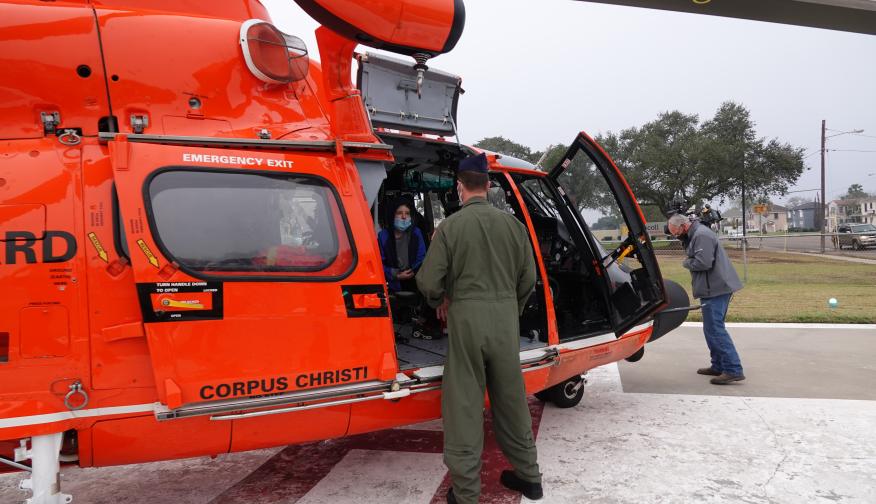 An emergency crew in a Coastguard helicopter on the hospital's helipad.