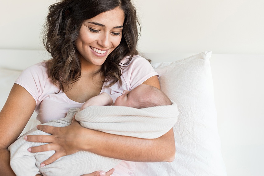 Happy mother holding her baby.