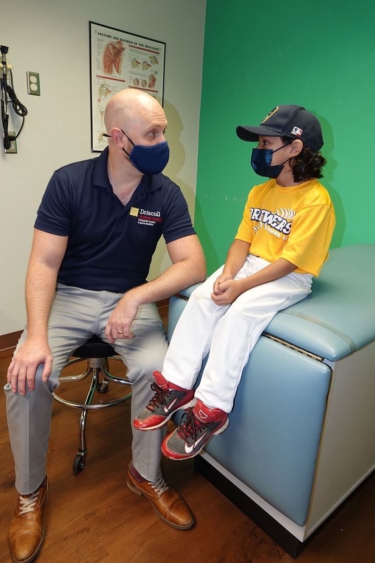 Sport Med Doctor with patient