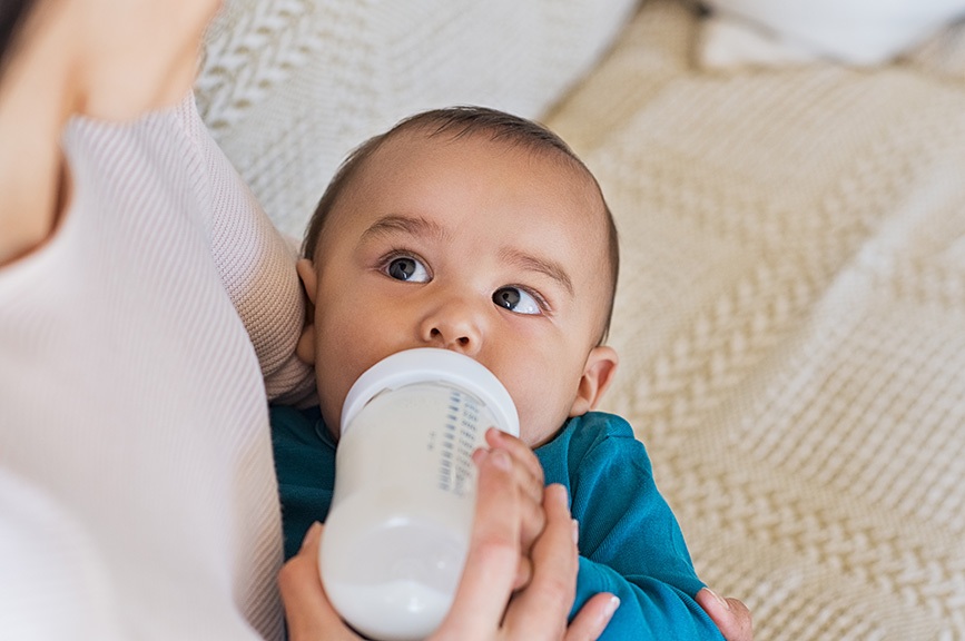 Mother bottle feeding her baby.