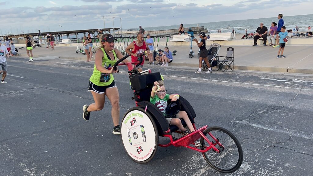 boy in wheelchair competes in race